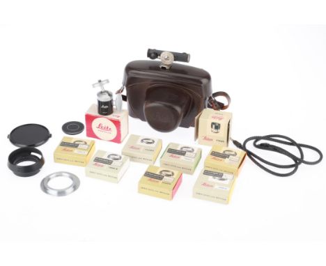 A Selection of Leica Filters and Accessories, to include a number of filters, a hood and a leather camera case.