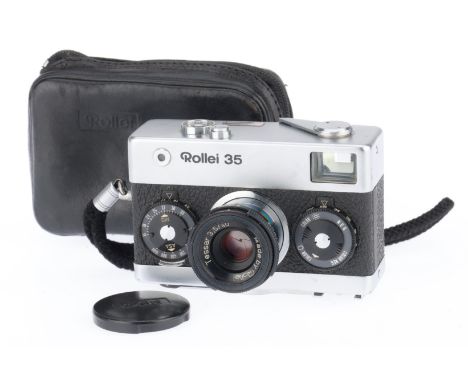 A Rollei 35 Compact 35mm Camera, black, serial number 3406493, body G, shutter works but sticks at slow speeds, iris works, w