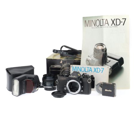 A Minolta XD-7 35mm SLR Camera, black, body G, some lifting of leatherette, shutter works at all speeds with batteries insert