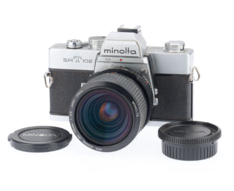 A Minolta SRT102 35mm SLR Camera, silver, serial number 2064629, body VG, shutter works, not battery tested, with an MD zoom 