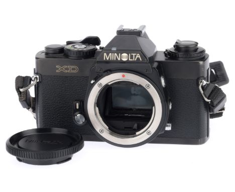 A Minolta XD 35mm SLR Camera Body, black, serial number 3313860, body VG, with batteries inserted the shutter works on manual