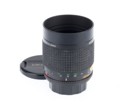 A Minolta f/5.6 RF 250mm Lens, black, serial number 1030732, barrel VG, optics VG, with caps.