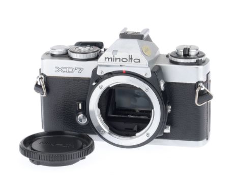 A Minolta XD-7 35mm SLR Camera Body, silver, serial number 2076862, body G, shutter works, fires using the self timer, does n