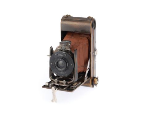 An Ensign Carbine Tropical Model Medium Format Folding Camera, body G-VG, Trichro shutter working, bellows open and close, no