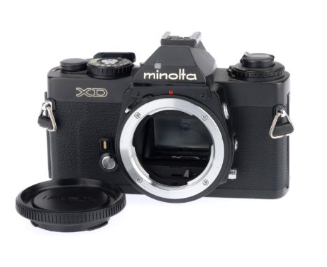 A Minolta XD 35mm SLR Camera Body, black, serial number 3099497, body VG, with batteries inserted the shutter works on manual