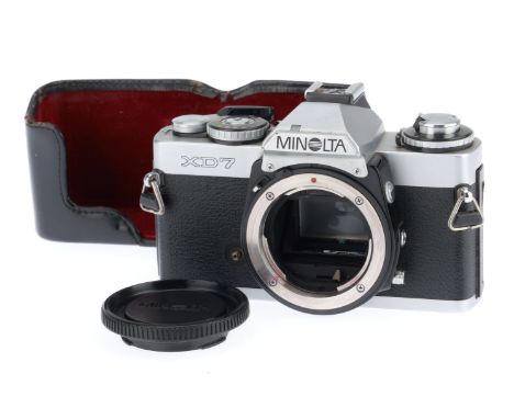 A Minolta XD7 35mm SLR Camera Body, silver, body F-G, shutter works, viewfinder display illuminates and appears to meter corr