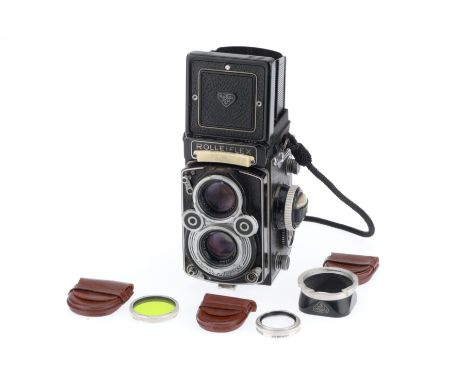 A Rolleiflex T Medium Format TLR Camera, black, serial number 2215515, body G, shutter blades are slow to open and close, iri