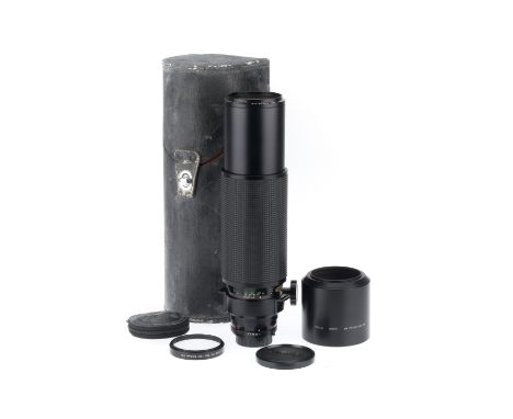 A Minolta Zoom Rokkor-X f/8 100-500mm Lens, black, serial number 1203414, barrel VG, optics VG, with caps, hood, accessory cl