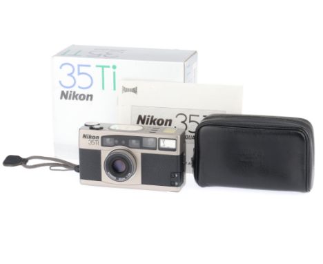 A Nikon 35Ti 35mm Compact Camera, silver, serial number 5012014, body VG-E, no visible marks, powers up, takes a picture, fla