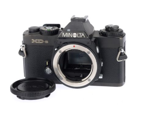 A Minolta XD-s 35mm SLR Camera Body, black, serial number 3090206, body VG, with batteries inserted the shutter works on manu