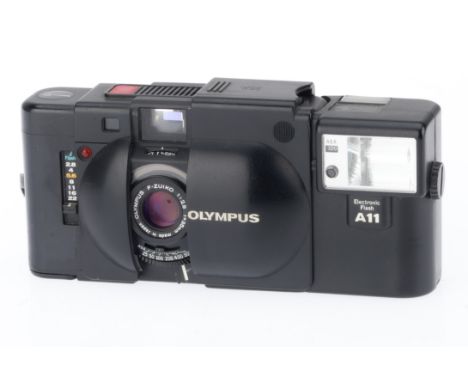 An Olympus XA 35mm Camera, black, body F-G, shutter and advance jammed, rangefinder not working, with A11 flash, not tested.