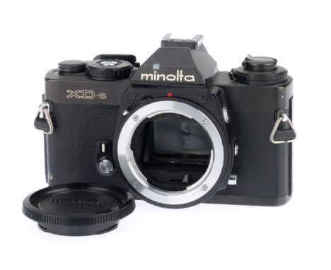 A Minolta XD-s 35mm SLR Camera Body, black, serial number 3043048, body VG, with batteries inserted the shutter works on manu