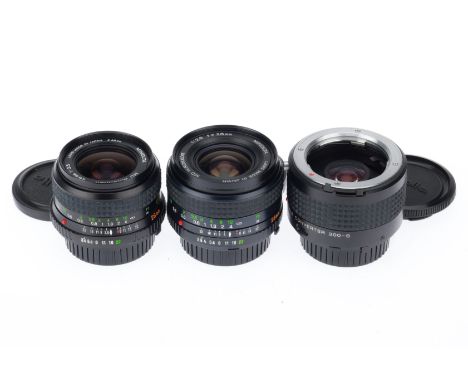 A Group of Minolta Short Prime Lenses, comprising a W.Rokkor-X f/3.5 28mm, a W.Rokkor f/2.8 28mm, and a 300-S 2X teleconverte
