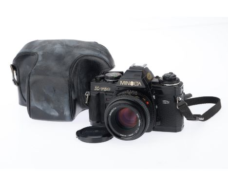 A Minolta X-700 35mm SLR Camera black, serial number 1095652, body G, shutter working when batteries inserted, viewfinder LED