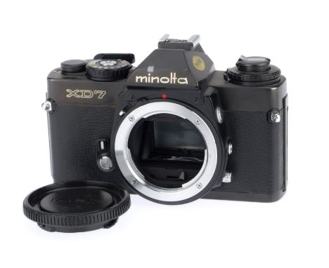 A Minolta XD7 35mm SLR Camera Body, black, serial number 2124639, body VG, with batteries inserted the shutter works on manua