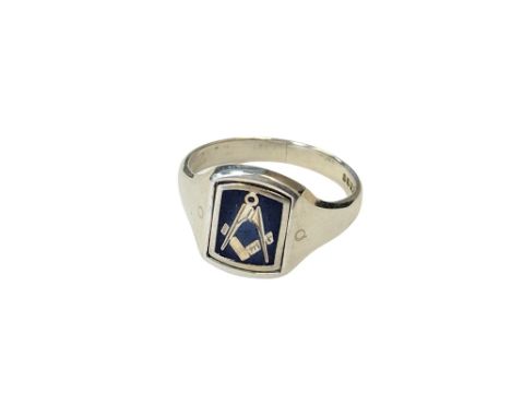 A silver masonic ring with swivel head 