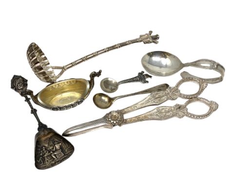 A group of silver and other items including caddy spoon, strainer, salt, grape scissors etc