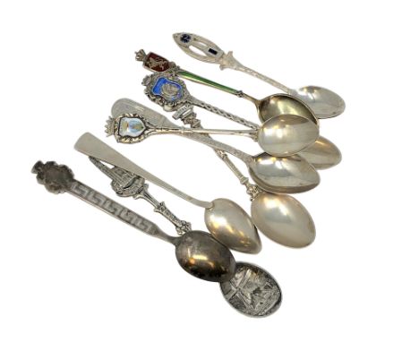 Nine assorted silver and enamel spoons. (9)