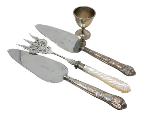 A Victorian silver egg cup and three items of silver mounted cutlery including toasting fork