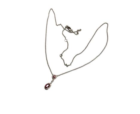 A 9ct white gold ruby and diamond pendant, the ruby approximately 0.45ct.
