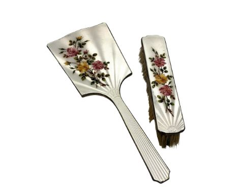 A two piece floral enamel and silver mirror and brush set 
