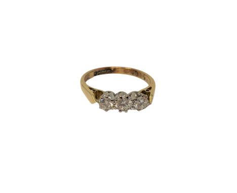 An 18ct gold three stone diamond ring, size K CONDITION REPORT: 2.6g