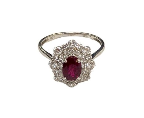 A ruby and diamond fancy cluster ring, approximately 0.81ct, ruby 1.03ct, size  N/O.