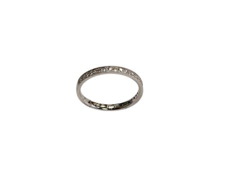 A platinum diamond half eternity ring, approximately 0.21ct.