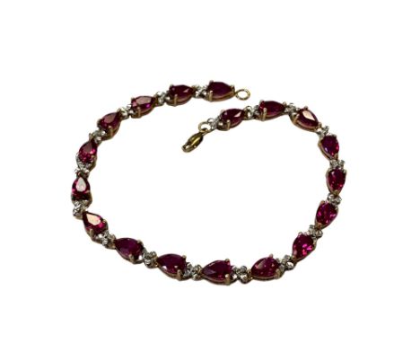 A gold simulated ruby bracelet  CONDITION REPORT: 7.7g