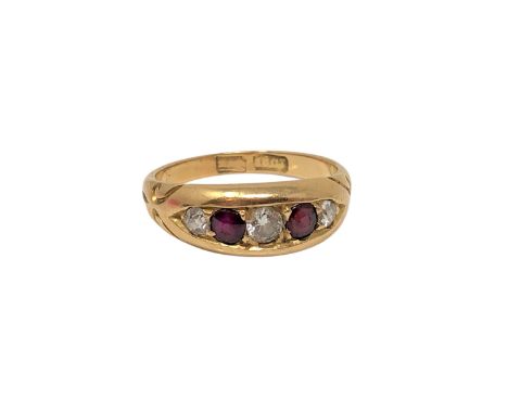 An antique 18ct gold ruby and diamond ring, size M CONDITION REPORT: 4.5g The central diamond approximately 3 mm in diameter.