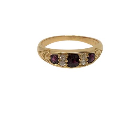 A gold diamond and ruby ring, size N CONDITION REPORT: Marks rubbed. 4g. 