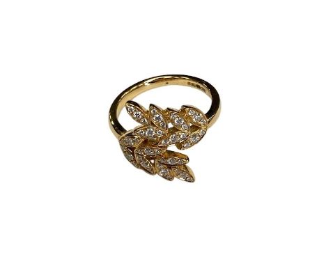 An 18ct gold diamond leaf design ring, size L/M.