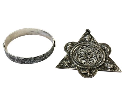 An unusual Italian silver pendant and a silver bangle 