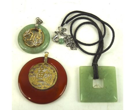 Two Chinese Jade pendants and a similar hardstone pendant, comprising two pendants of circular form and one of square form