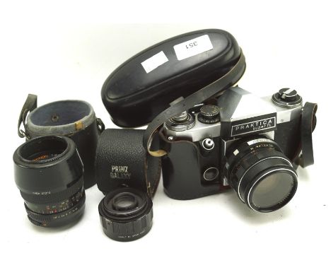 A selection of vintage camera equipment, to include a Praktica super TL camera with 1.8/50 lens and two other lens