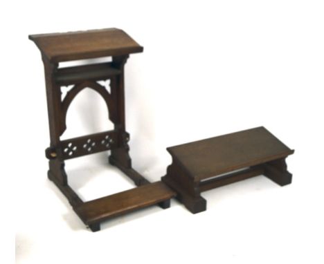 Two oak kneelers, one with book slope and hinged kneeler, pierced with quatrefoil motifs, height 76cm, the second as a sloped