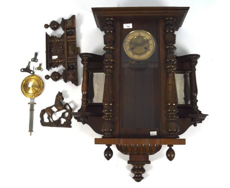 An early-mid 20th century Vienna wall clock, the brass dial with Roman numerals, within a mahogany case flanked by mirrors to