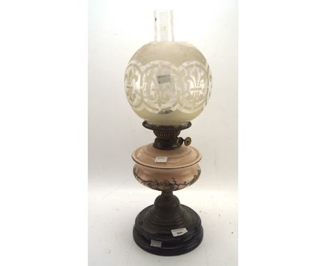 An early 20th century Duplex oil lamp, the glass reservoir decorated with fruit and vine scenes, with original glass shade an