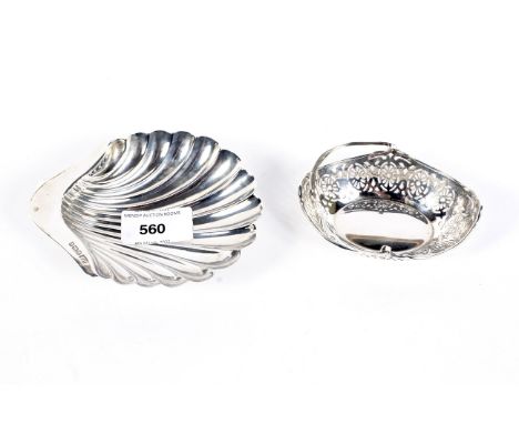 A silver dish of Scallop form and a pierced swing handled dish, the shell dish hallmarked Sheffield 1911 by Atkin Brothers, 9