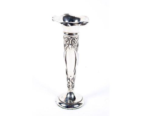 An early 20th century silver spill vase, decorated with floral motifs, hallmarked Sheffield 1910, 14.5cm high