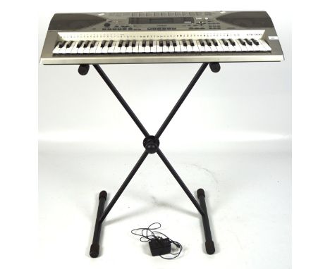 A Casio CTK-900 keyboard with matching stand, the keyboard itself measuring 94cm wide