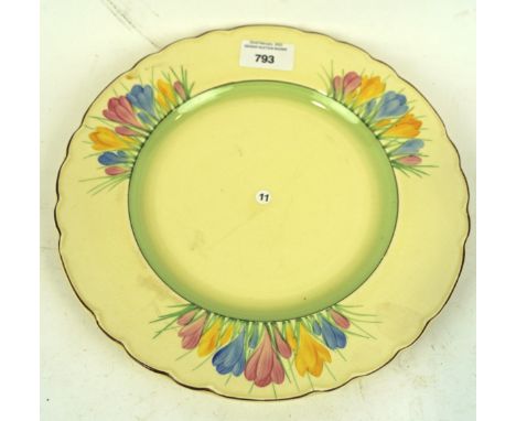 A Royal Staffordshire Pottery Honeyglaze Clarice Cliff plate, painted in the crocus pattern, with a fluted edge, diameter 26c