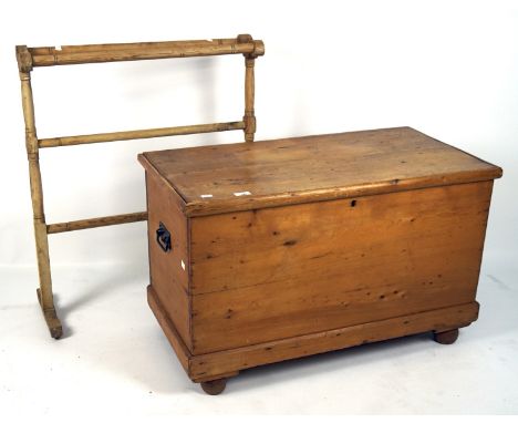 A late 19th century pine storage trunk and a pine clothes stand, the trunk with small fitted lidded compartment to one side, 