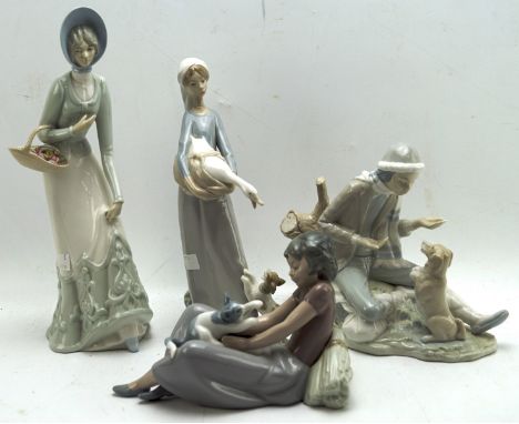 Four ceramic figures, including two Nao figures, one featuring a woman with a cat and the other a boy with a dog, one Lladro 