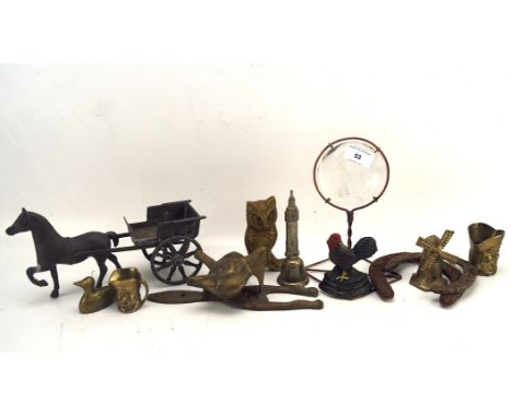 A collection of metal and brassware, including two horseshoes, a fox head door knocker, miniature toby jugs, a chicken doorst