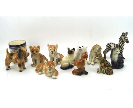 A collection of ceramic figures of animals, the majority being USSR, including dogs, cats, a zebra, polar bear and more, toge