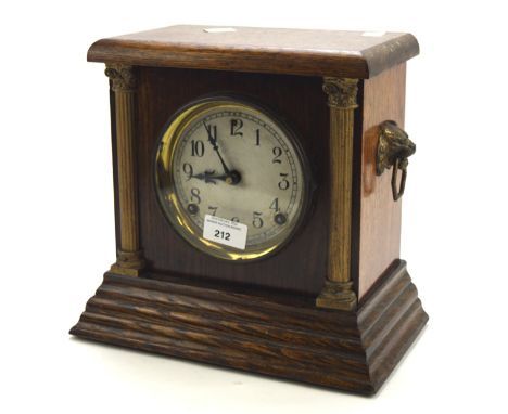 A mid 20th century American Sessions Clock Company mantle clock, the silvered dial with Arabic numerals and within an oak cas