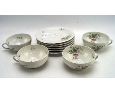 A 20th century Limoges porcelain part teaset, comprising four teacups and six saucers