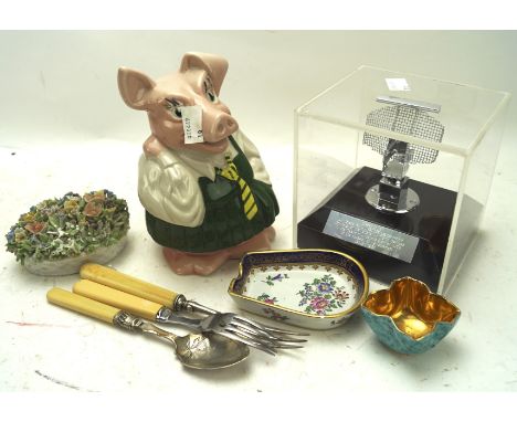 An assortment of collectables, including a Natwest pig, flatware, a ceramic dish and more