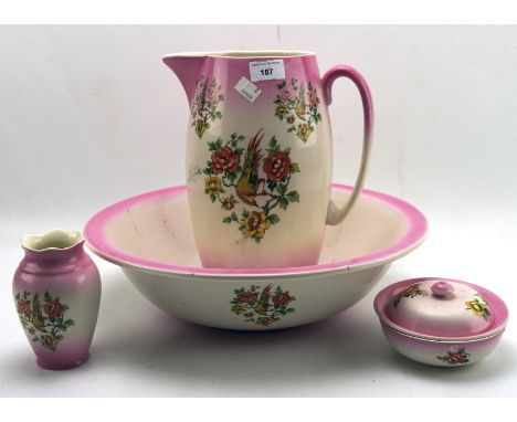 A jug and basin wash set with matching vase and lidded soap dish, decorated with birds on flowering branches, with pink rims